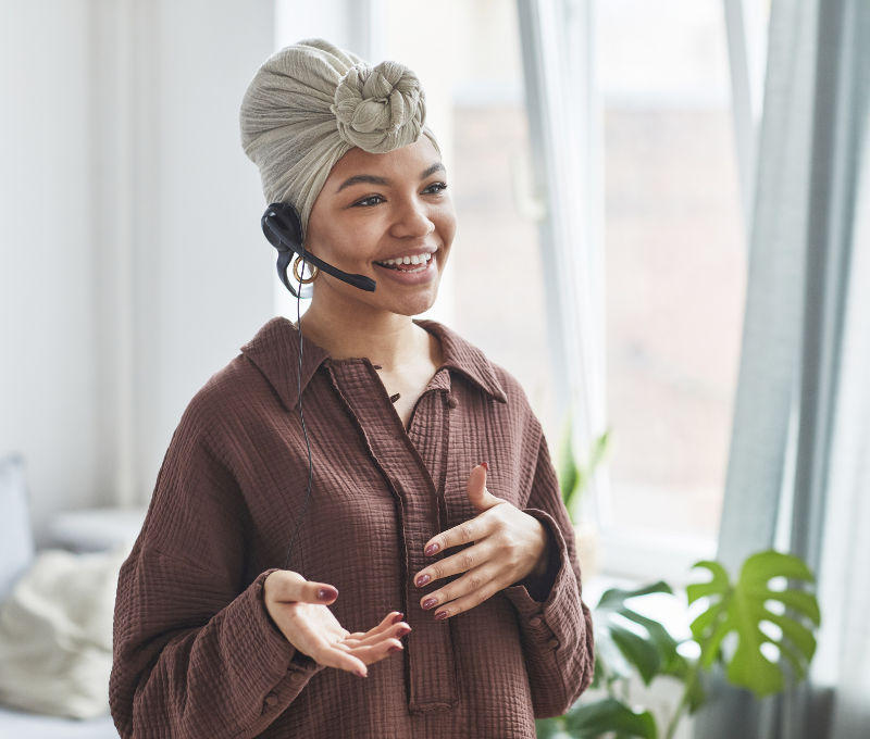 Women presenting with a microphone on her ear